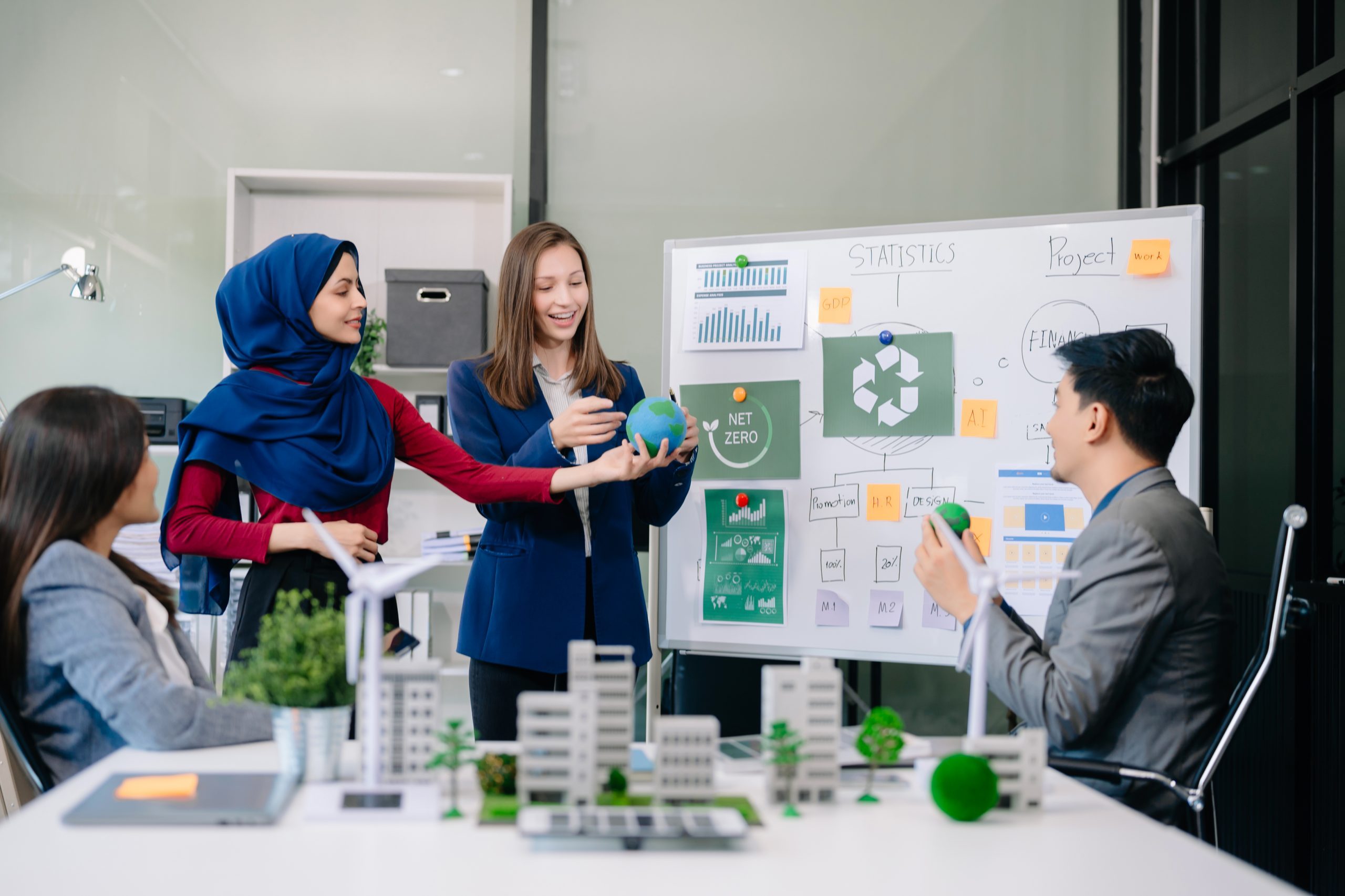 Group of alternative energy engineers discussing a project with
