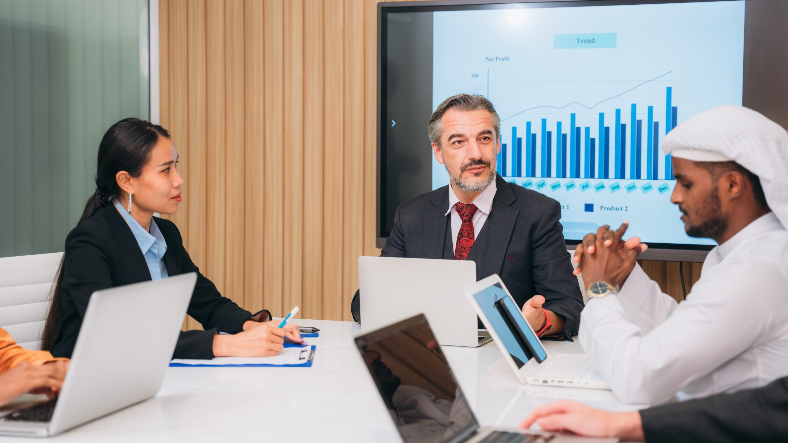 Group of business meeting about documents and ideas at the office desk. Discussion among businesspeople on the latest developments.