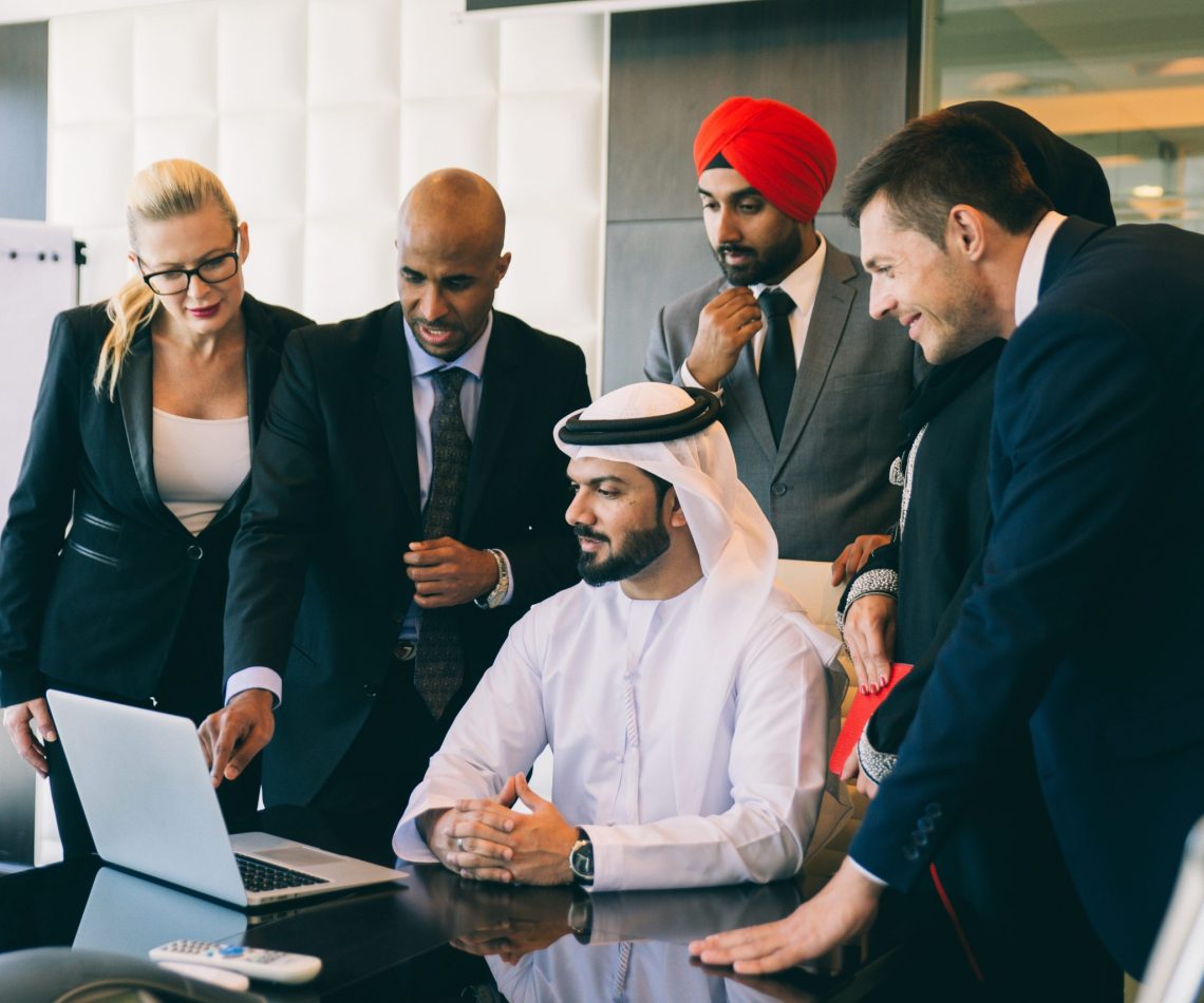 Mixed business team making agreements on future business plans.