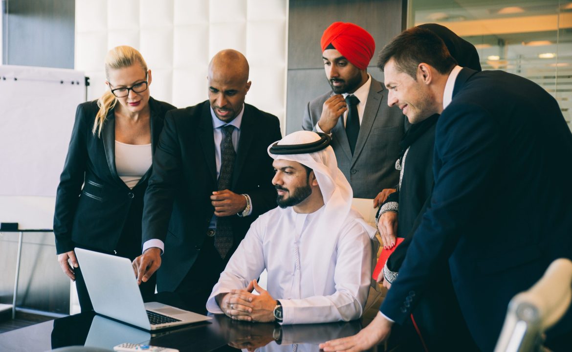 Mixed business team making agreements on future business plans.