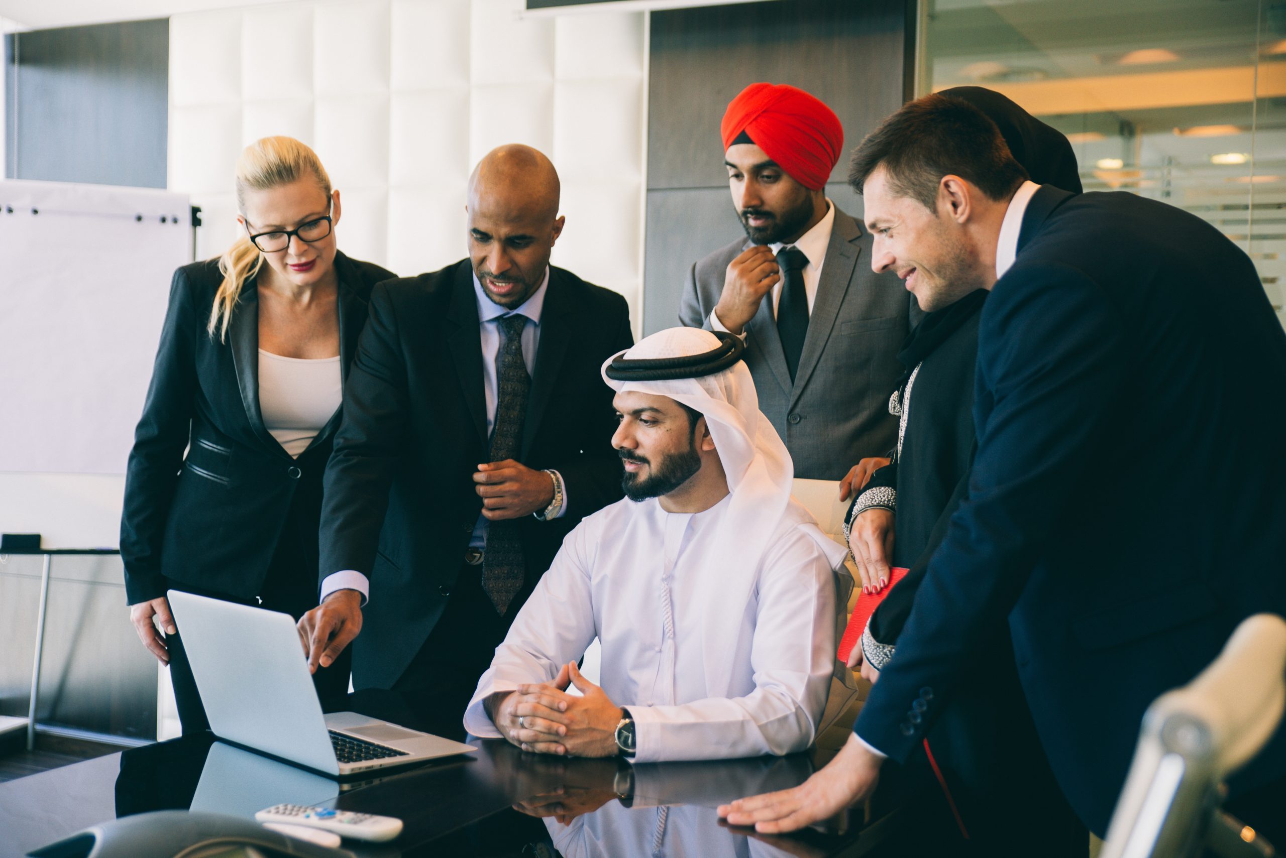 Mixed business team making agreements on future business plans.