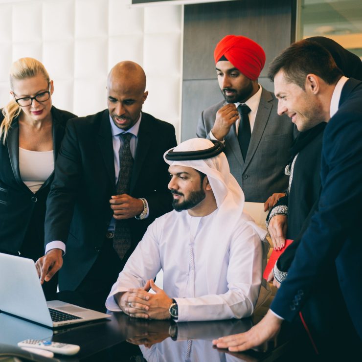 Mixed business team making agreements on future business plans.