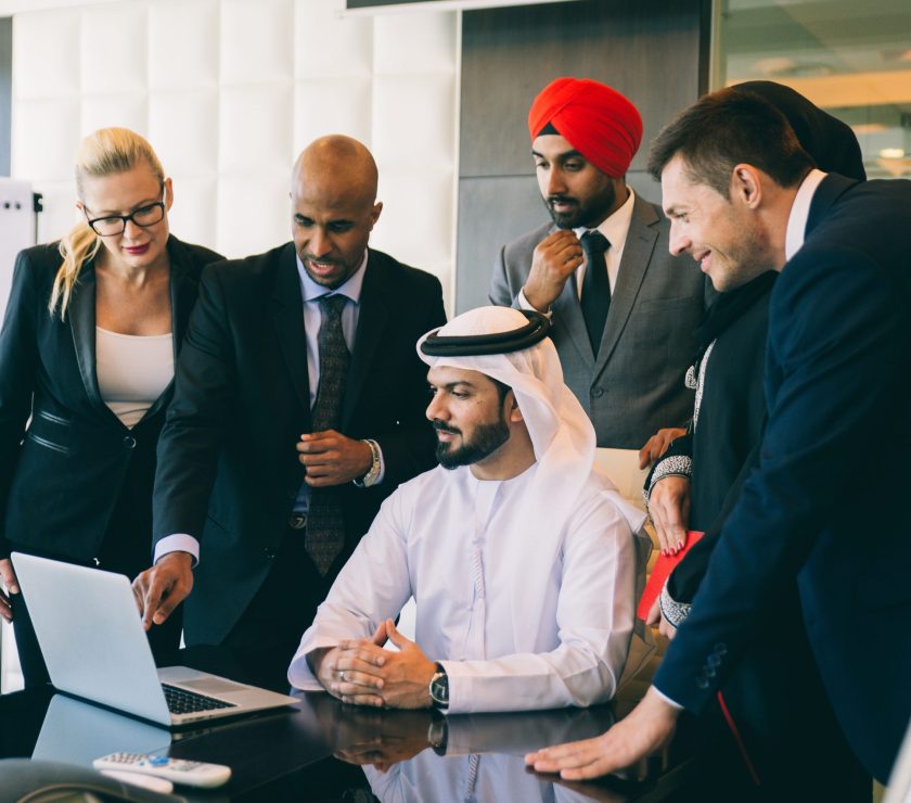 Mixed business team making agreements on future business plans.